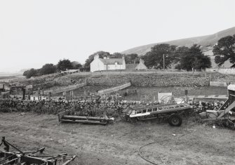 Kimote House: General view of steading with stackyard in foreground from E