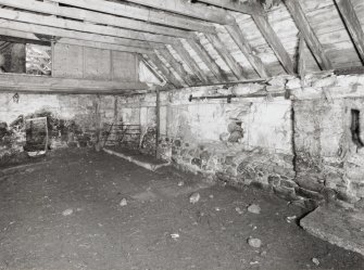 View showing back wall of cattle shed from SE
