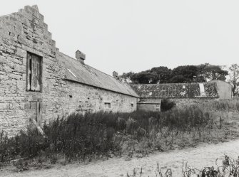View of rear of steading from NW, with threshing barn in background