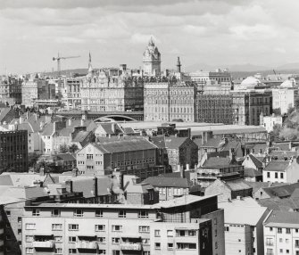 Distant view showing The Balmoral Hotel, North Bridge and the former GPO building from Salisbury Crags to South East