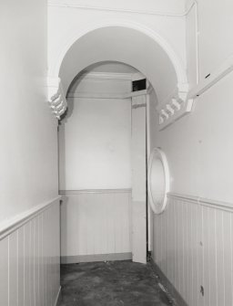 First floor, South East corner, corridor, detail of arch and oculus