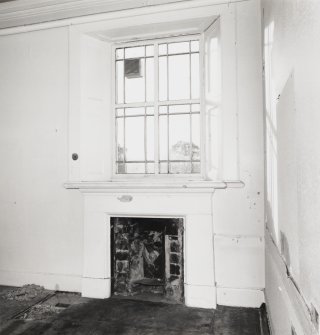 Second floor, room 26, detail of fireplace and window