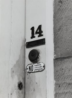 Front door, door plaques, number and bell, detail