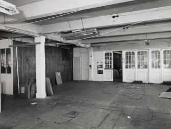 Interior view of the first floor of the main block of C&J Brown's warehouse seen from the East.