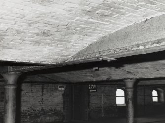 Warehouse No. 3, interior.
View of wrought iron beam and conjunction with brick vaulting on level 5 in the Southern half of the building.