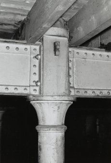 Warehouse No. 3, interior.
View of round cast iron column head and wooden rafters on level 4, Southern side of building.