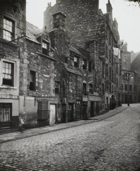 General view of old buildings on North East side of street.