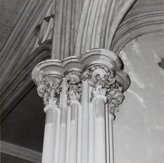 Detail of east end capital showing former colour scheme with graining and gilding