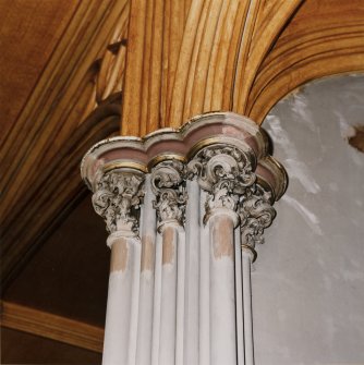 Detail of east end capital showing former colour scheme with graining and gilding