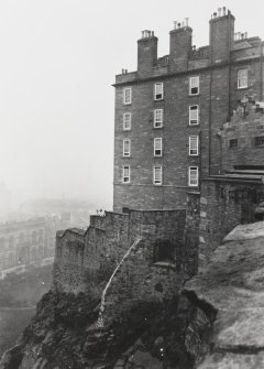 Copy of historic photograph showing corner of New Barracks and outer wall from S.  
Mount signed: 'Thomas Ross' and inscribed: 'Edinburgh Castle. Decr 1912.'