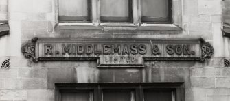 Detailed view of the inscription on the Salisbury Place facade: 'R Middlemass & Son. Limited. 1895' seen from the North North West.