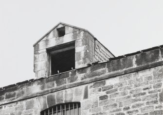 Detail of hoist tower on South West side of block 3 in Warehouse range.