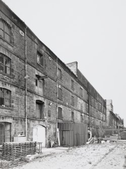 General view from North East of rear (North East) elevation of Warehouses, blocks 1, 2, 3.