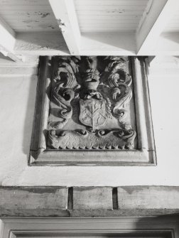 Detail of armorial panel above door in North wing of Old Craig House.