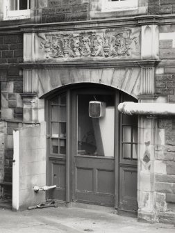 Detail of basement level doorway on South facade of Craig House.