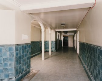 Interior, general view of lower East corridor in Craig House from East.