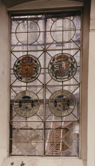 Interior-detail of stained glass window in centre of chapel's South elevation.