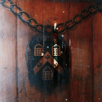 Interior-detail of painted decoration on curved bench.