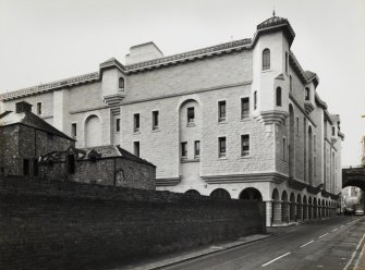 View from North East of West wing of Brewery containing Stables, Harness Room and Hay Loft situated adjacent to Tailor's Hall, and the new Sheriff Court nearing completion