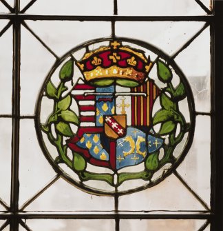 Detail of circular stained glass panel in South wall depicting the coat of arms of Mary Of Lorraine and Guise, mother of Mary Queen of Scots.