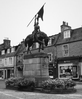 View of statue commemorating the return of Hawick callants from Holnshole in 1514 by W F Beattie (1914) from W