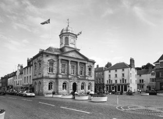 View of town hall from NW showing 1-5 Woodmarket in the background