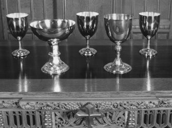 Interior.
Detail of communion plate; five silver communion cups.