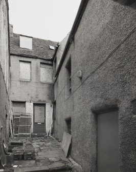 View (through pend) from West