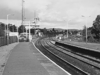 View of signal gantry and signal box to N side of station