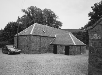 Exterior view of mill from NE, showing 'T'-plan shape of building.  The building was restored during 1996, the original conical kiln vent having been removed in 1968