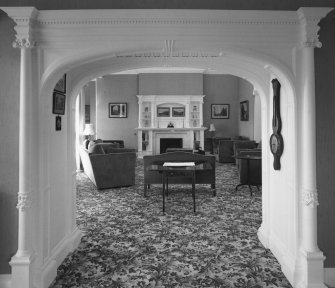 Interior.
View of first floor drawing room from library to E through the connecting archway.