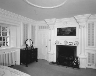 Interior.
View of East wing first floor old sitting room from North showingfireplace flanked by Ionic columns.