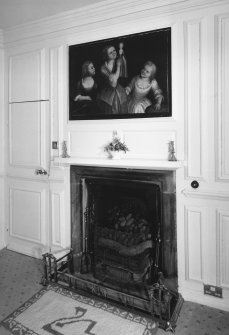 Interior.
East wing first floor bedroom, detail of fireplace and overmantle painting of three girls and a doll.