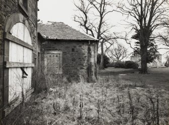 View from S showing stables and house.