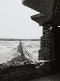 Edinburgh, Cramond Island, The Knoll battery and anti-shipping barrier.  View of anti-shipping barrier from the North end showing part of The Knoll battery constructed to defend the tidal area between Cramond and the Island.