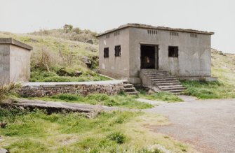 Edinburgh, Cramond Island, Cramond Battery, coast battery. View of gun battery engine house from North East showing entrance with steps, ventilators and steel window shutters..