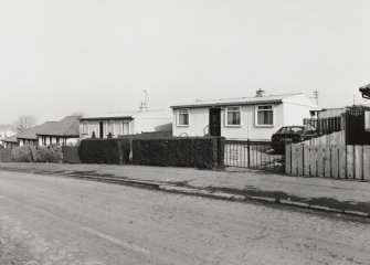 View from SW of one of several remaining prefabricated houses in Craigour Drive and Craigour Avenue.
'AIROH', prefabricated aluminium bungalow, Moredun area, Edinburgh (built 1949).