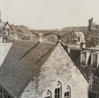 View of gable and roof of Dean School with Dean Bridge beyond