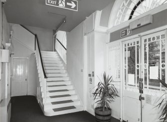 Interior. View of entrance lobby from East showing original stair to galleries