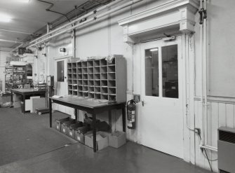 Interior. View of canopied doors original entrance to worship space in North wall of main warehouse from East South East