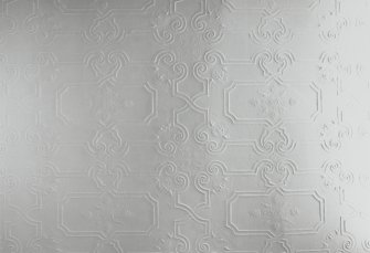 Detail of embossed ceiling paper in second floor corridor