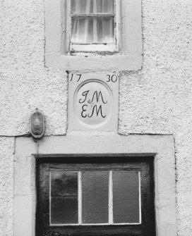 Detail of marriage lintel dated 1730 above farm-house door