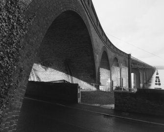 Detailed view from SSE of the curved brick viaduct forming the south end of the bridge.