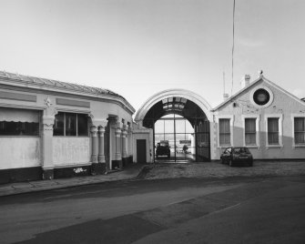 View from SSE of the W side of the S end of terminal building, including the adjacent range in Boat Brae