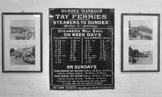 Detail of old enamel sign (on the wall of the ferry terminal offices) providing information on ferry times