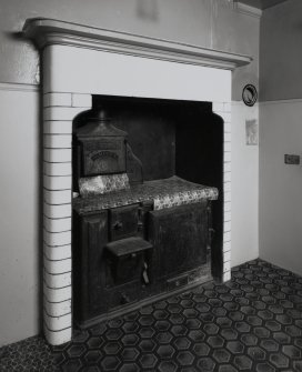Interior.
Detail showing fireplace in servants room.
