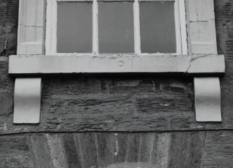 South frontage, detail of first floor carved window cill.