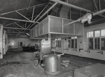 Interiorview of main kitchen showing oven and extraction hood.