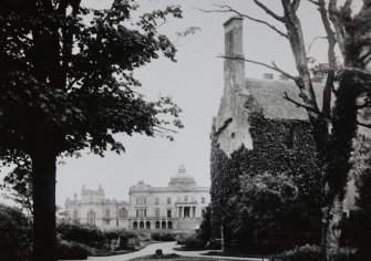 Copy of historic photograph showing general view of old and new houses.