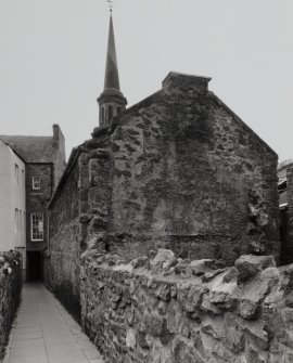 View of outhouses to rear from NE.